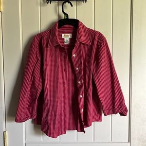 Half sleeve button up maroon shirt. White stripes with white buttons.
